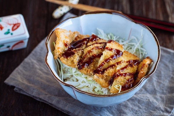 Crispy Tonkatsu over bed of rice and shredded cabbage.
