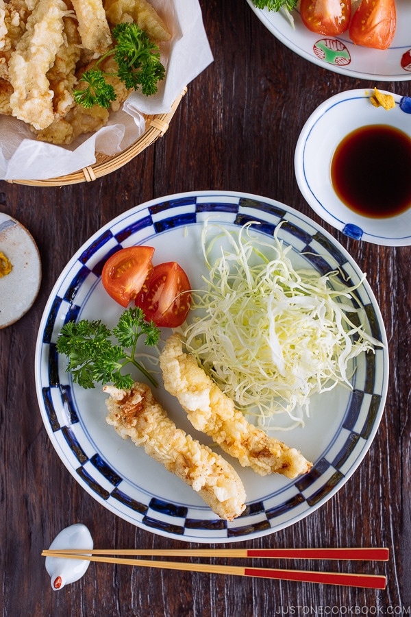 Japanese plate containing Chicken Tempura (Toriten) and shredded cabbaage, served with ponzu sauce and Japanese karashi hot mustard.