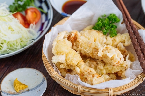 Chicken Tempura (Toriten) in a bamboo basket, served with ponzu sauce and Japanese hot mustard karashi.