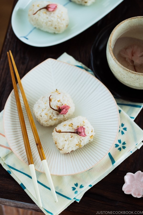 Cherry Blossom Rice Balls on a white ruffled plate.