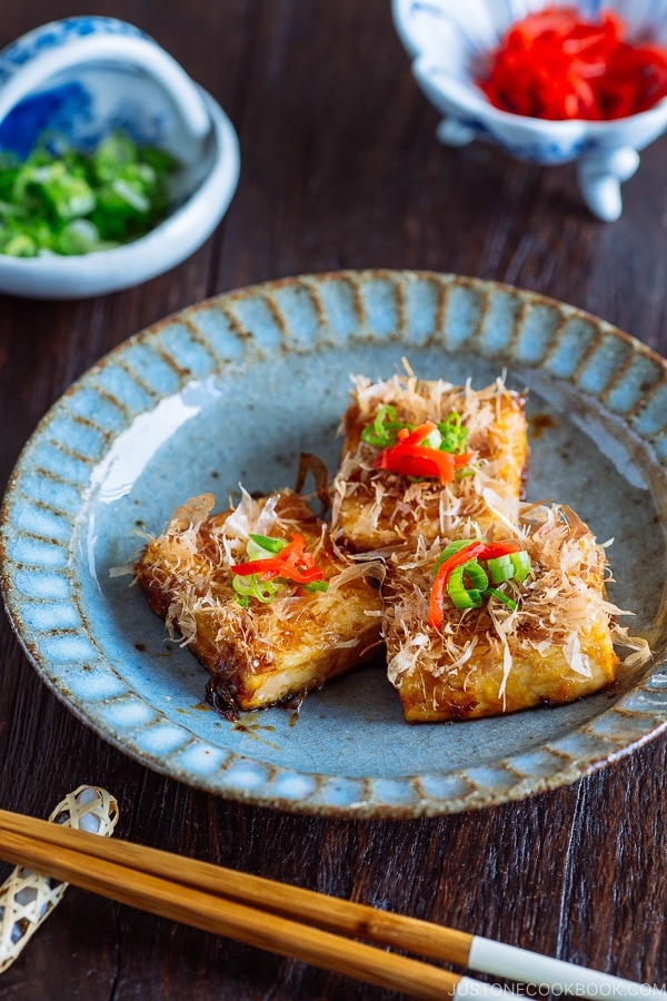 Three pieces of Teriyaki Tofu are placed on a Japanese blue plate | Easy. Japanese Recipes at JustOneCookbook.com