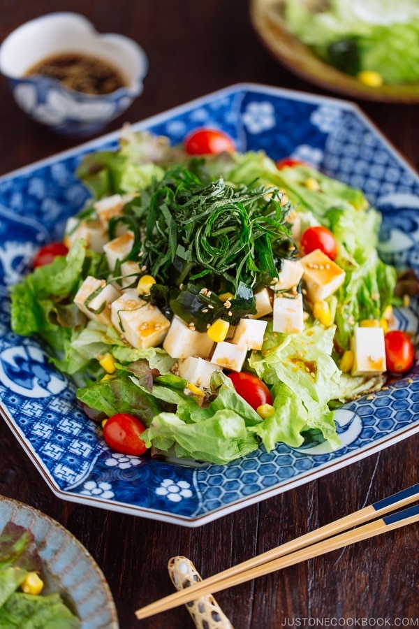 Refreshing Tofu Salad with Sesame Ponzu Dressing on a Japanese blue platter.
