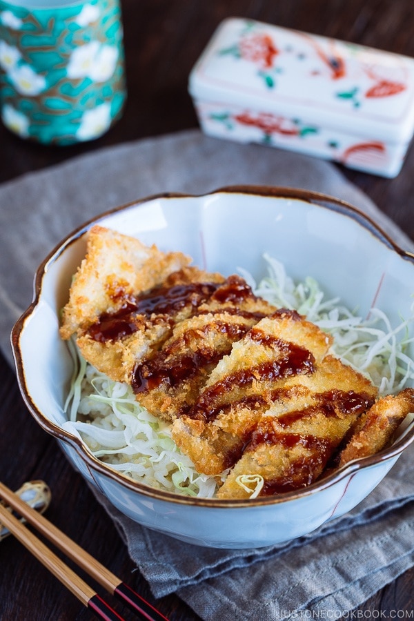 Crispy Tonkatsu over bed of rice and shredded cabbage.