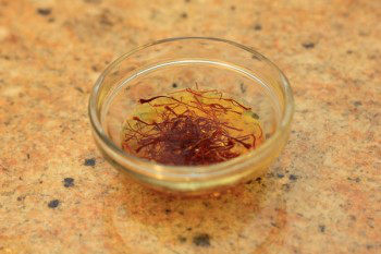 saffron soaking in a glass bowl