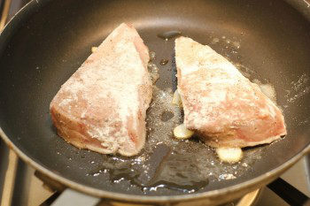 hamachi cooking in a frying pan