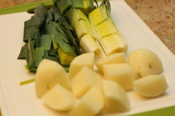 leak and potato chopped into smaller pieces on top of white plate