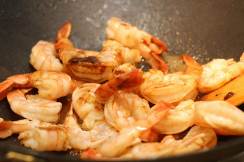 shrimp stir fry in a metal pan