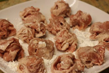 teriyaki pork ball with flour on a white plate