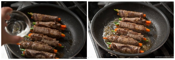 A pan with beef rolled up vegetables simmering in sauce