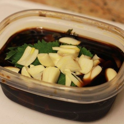 Shiso Garlic Soy Sauce in a plastic container.