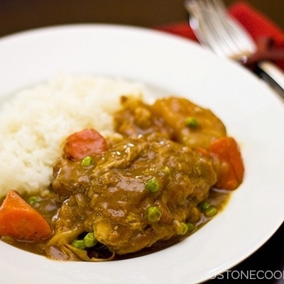 Chicken Curry with white rice on a plate.