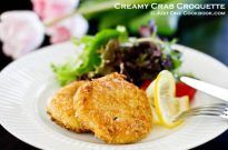 Creamy Crab Croquette and salad on a plate.
