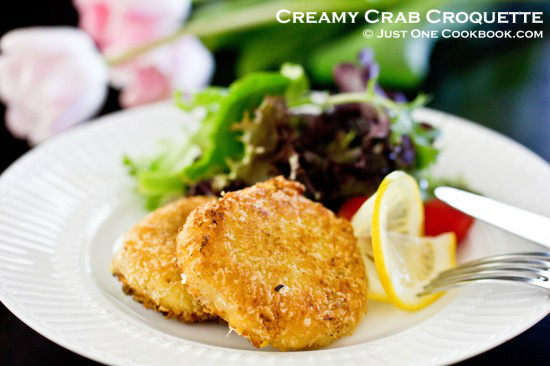 Creamy Crab Croqueet and salad on a white plate.