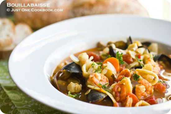 Bouillabaisse in a white bowl.