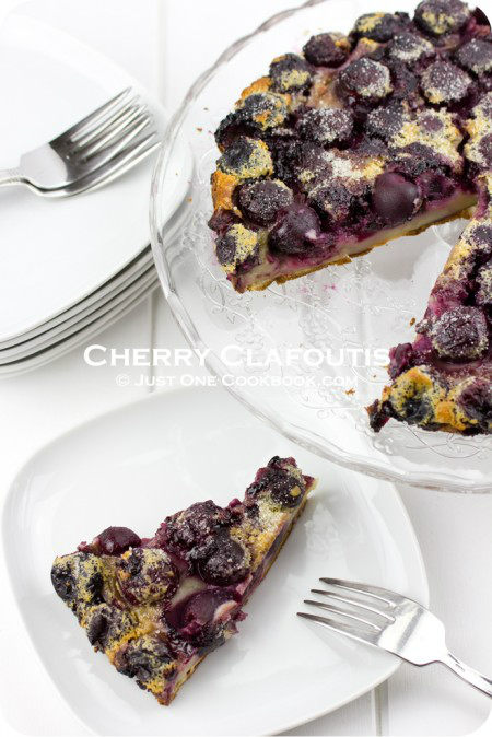 Cherry Clafoutis on a plate and a cake stand.
