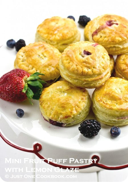 Mini Fruit Puff Pastry with berries on a cake stand.