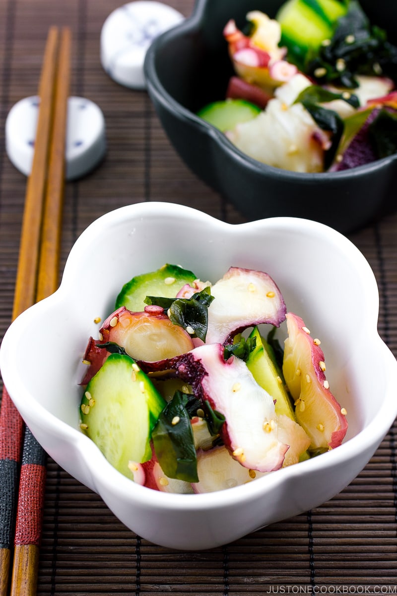 Octopus salad with cucumbers in small bowls