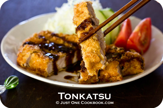 Tonkatsu and salad on a plate.