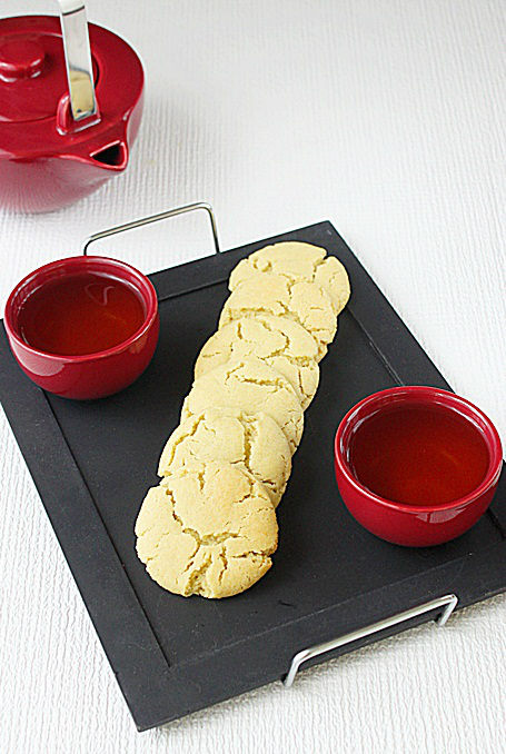 Green Tea Cookie and a tea set on a table.