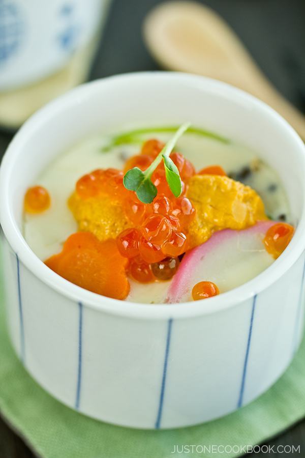Chawanmushi topped with uni and ikura in a cup.