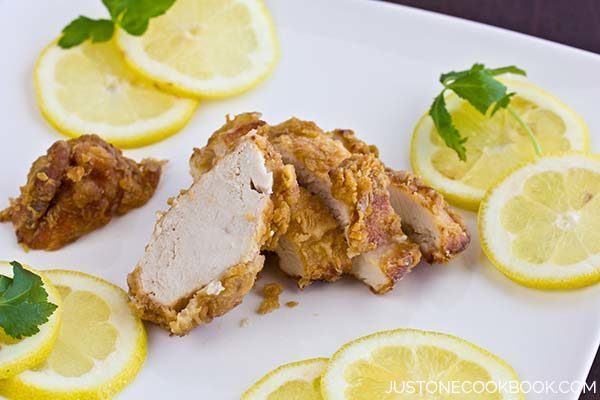 Lemon Chicken with sliced lemons on a plate.