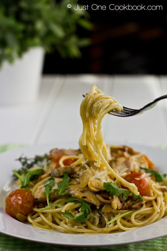 Chicken Scallopini with Lemon Butter Pasta on a fork.