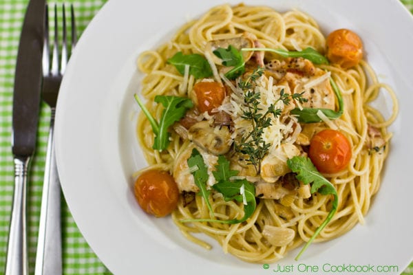 Chicken Scallopini with Lemon Butter Pasta on a white plate.