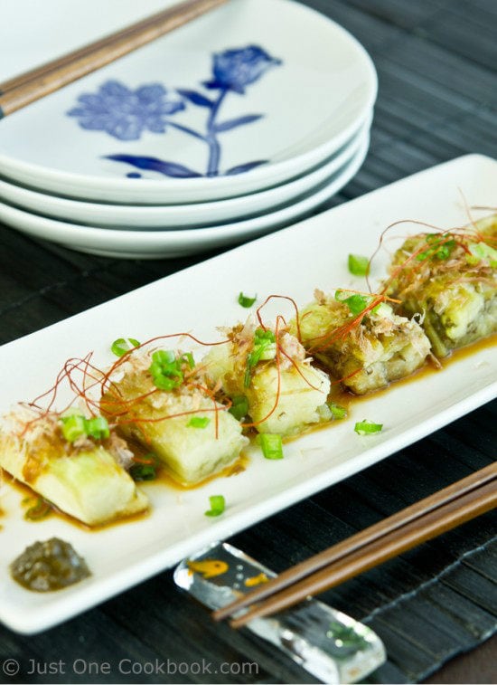 Japanese Grilled Eggplant (Yaki Nasu) on a long rectangular plate.