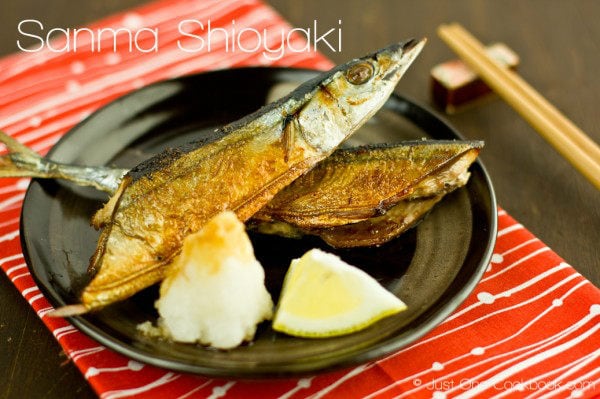 Sanma Shioyaki (Salt-Grilled Pacific Saury) on a plate with grated daikon.