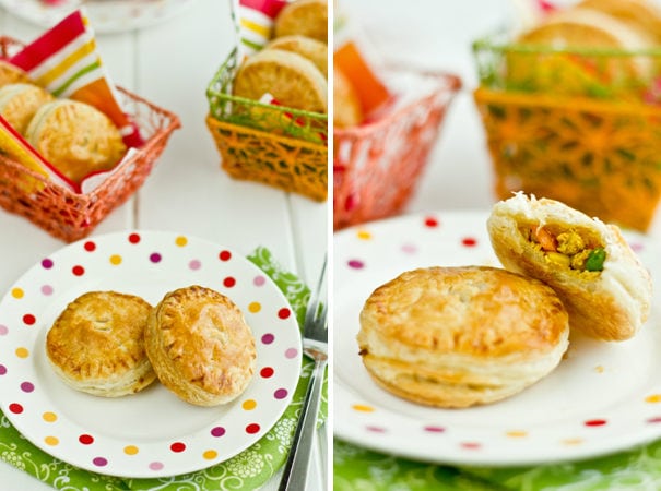 Tandoori Chicken Puffs on plates and baskets on a table.