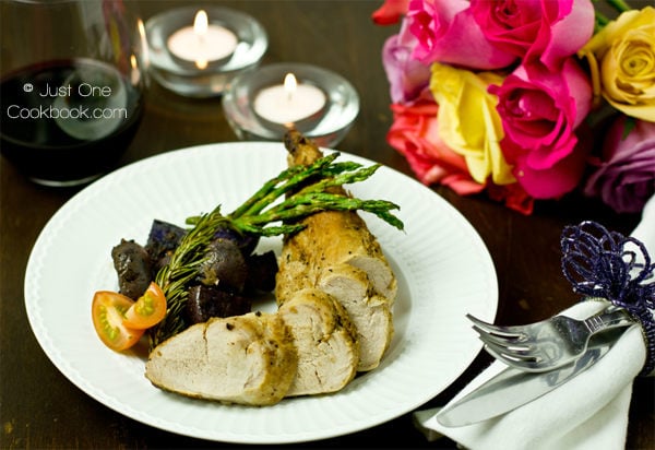 Thomas Keller's Pork Tenderloin with potatoes and asparagus on a plate.