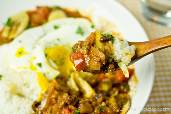 Arroz a la Cubana and white rice on a spoon.