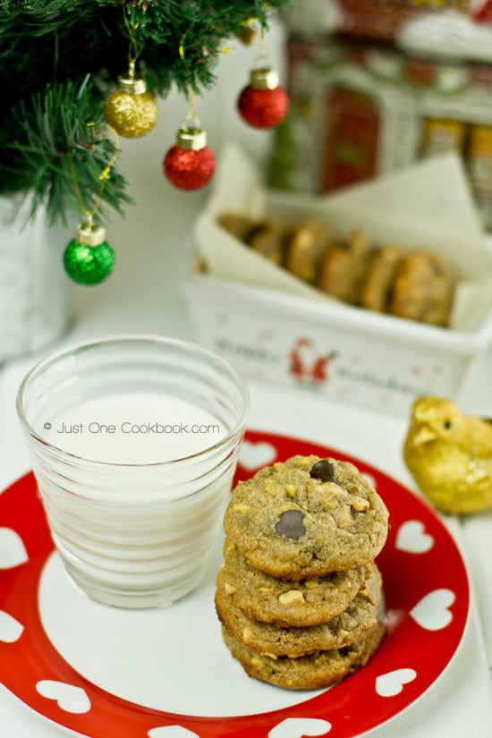 Peanut Butter Chocolate Chip Cookies II Peanut Butter Chocolate Chip Cookies and a glass of milk on a plate.