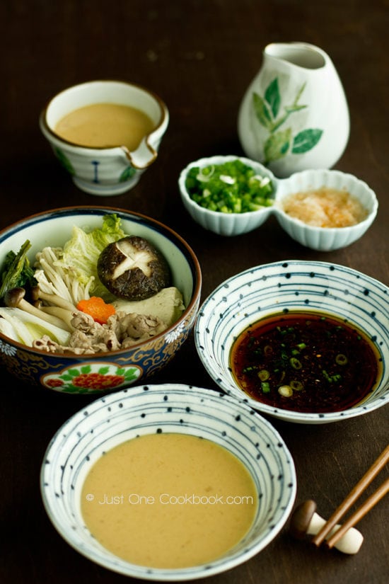 Shabu Shabu and dipping sauce on a table.