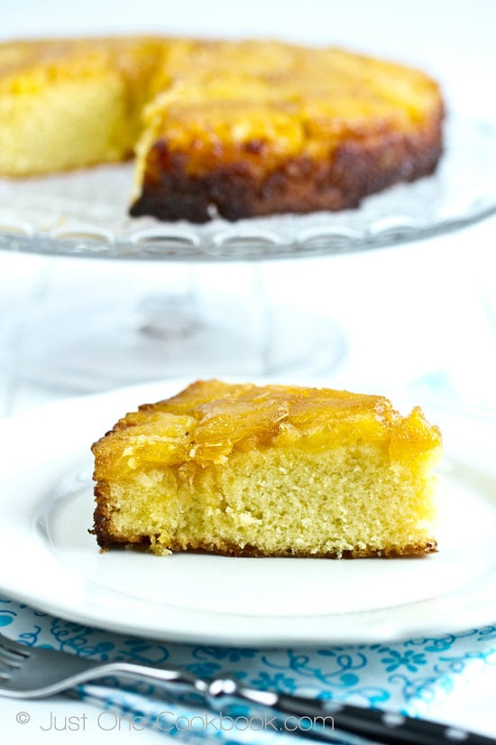 Pineapple Upside Down Cake on a plate and a cake stand.