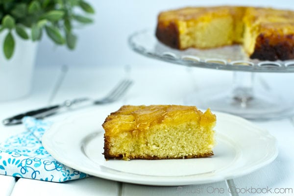 Pineapple Upside Down Cake on a plate and a cake stand.