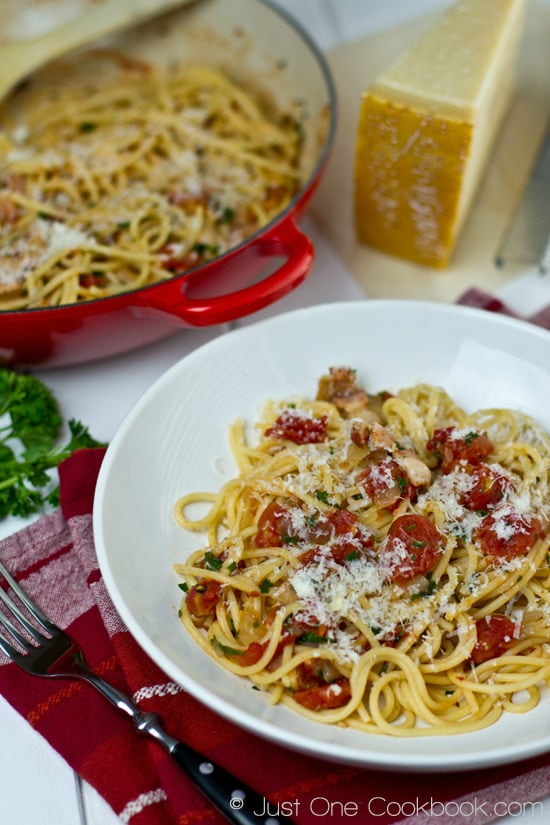 Tomato Bacon Pasta on a plate and a pan.