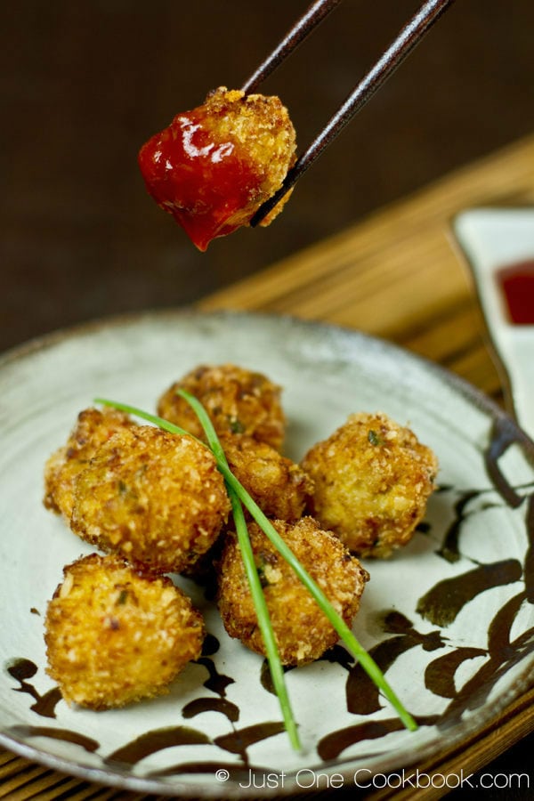  Deep Fried Shrimp Ball covered with ketchup.