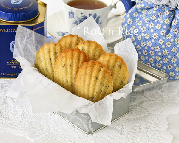 Lavender Madeleines in a box and a cup of tea.