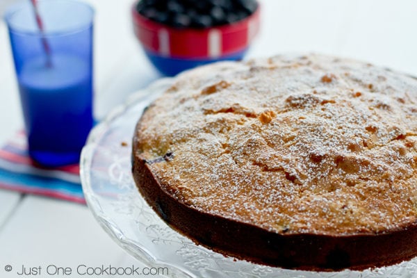 Blueberry Cake on a cake stand.