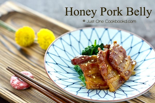 Honey Pork Belly and spinach in a bowl. 