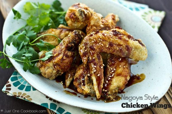 Nagoya Style Fried Chicken Wings topped with white sesame on a white plate.