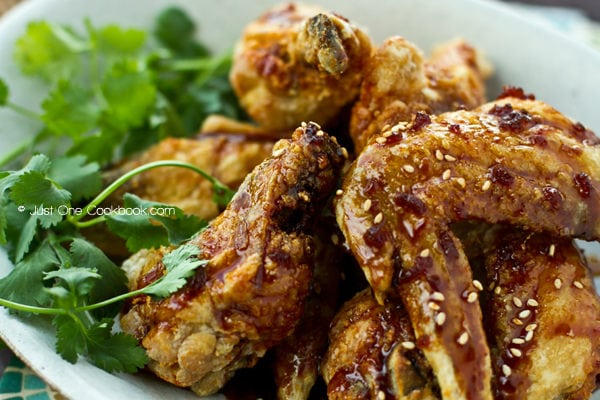 Nagoya Style Fried Chicken Wings coated with savory sweet garlic soy dressing on a white plate.