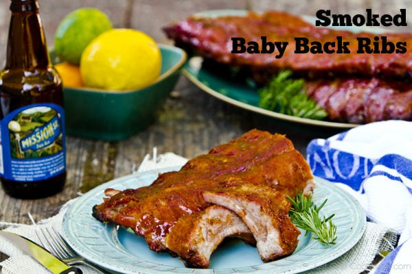 Smoked Baby Back Ribs on a table with drink.