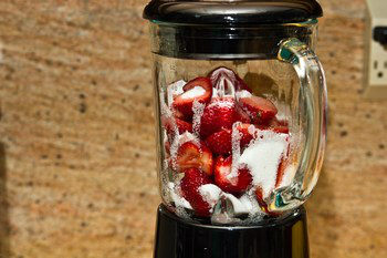 strawberries, sugar, lemon juice and salt in blender