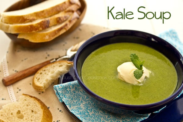 Kale Soup and bread on a table.