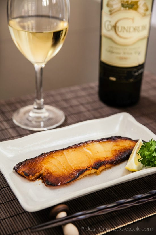 Miso Chilean Sea Bass with a glass of wine.