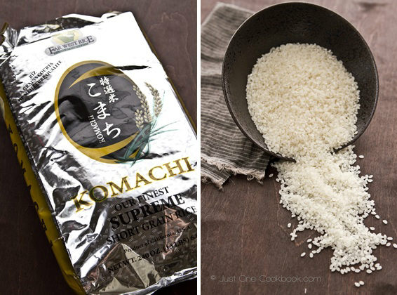 Japanese short-grain rice in a black bowl on top of wood board