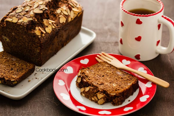 Nutella Banana Bread and a cup of coffee on a wooden table.