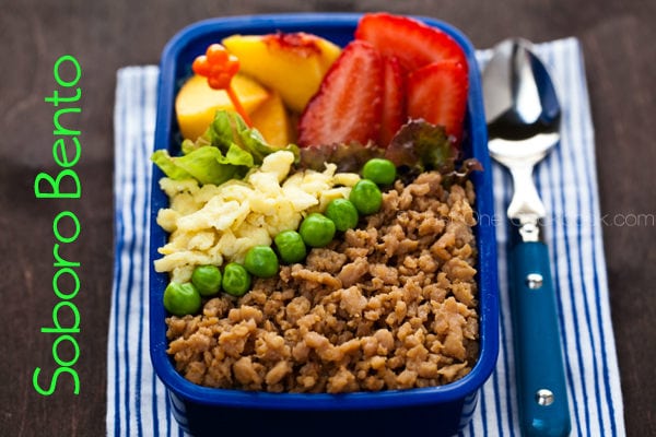 Soboro Bento with sweet tender ground chicken, green peas, egg, and fruits.